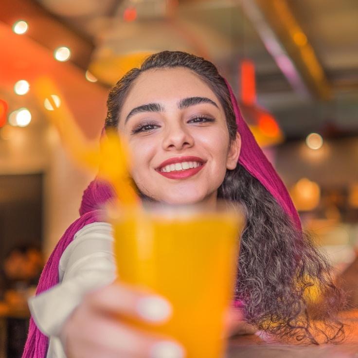 Alex Rivera, Lead Design Curator at Sunrise Harbor Gateway, reviewing corporate floral arrangements